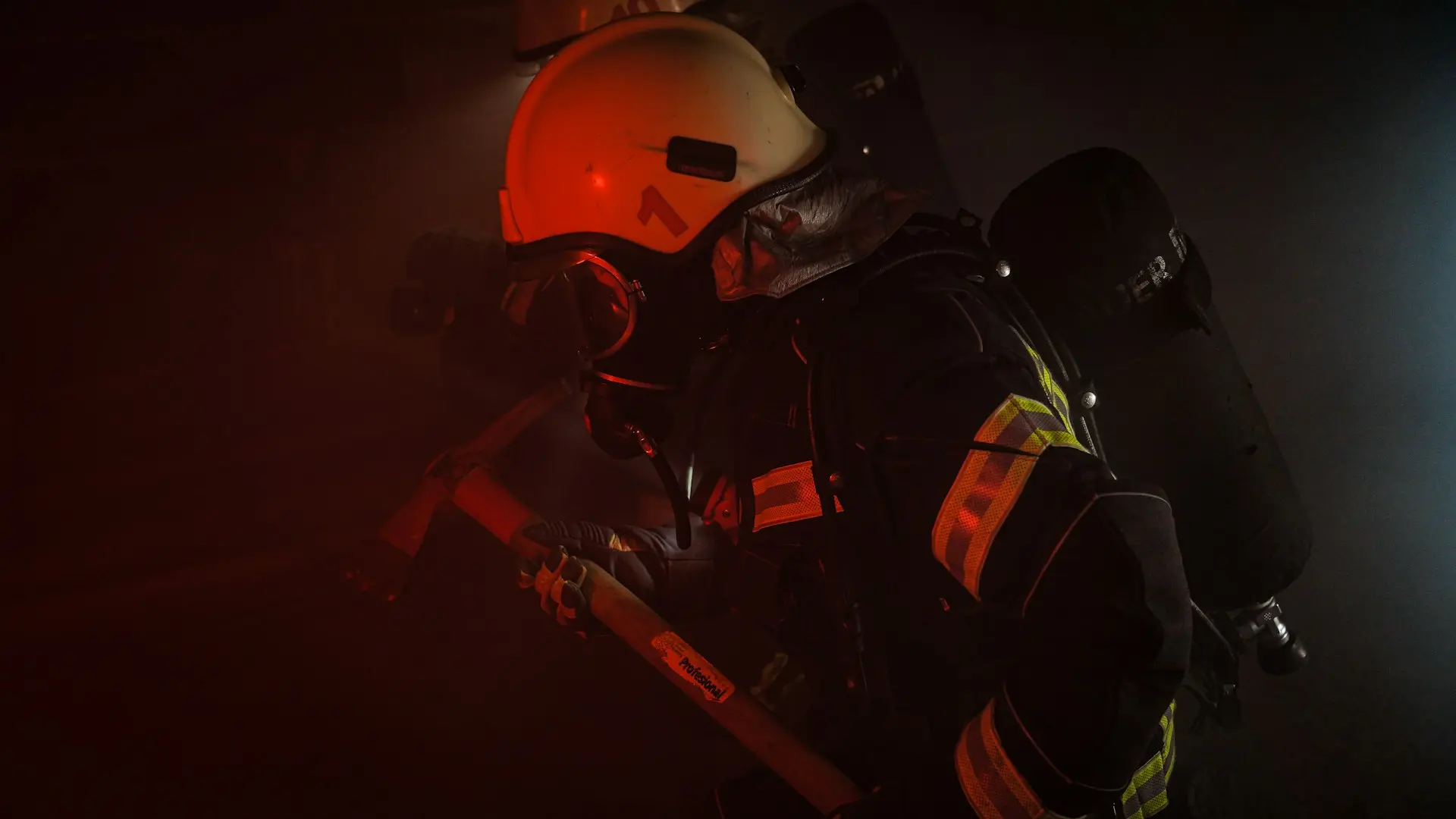 man in orange helmet and black helmet